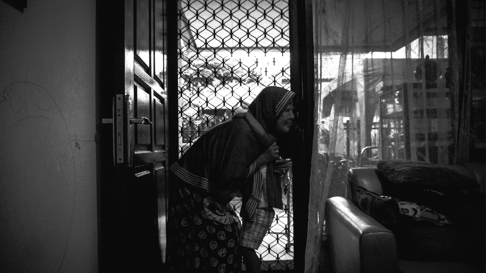 Lilik Sulistiowati, known as Mami Vera, at the shelter she founded in Dukuh Kupang Timur, Surabaya, Indonesia.