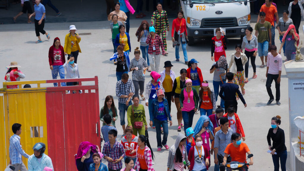 Workers leave a garment factory at the end of their shift in Cambodia in 2016.