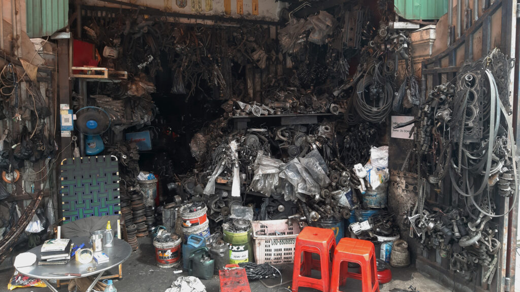 An auto repair shop in Phnom Penh that employs a Cambodian teenager who left school after his school shut in 2020 due to the COVID-19 pandemic. Paul Millar